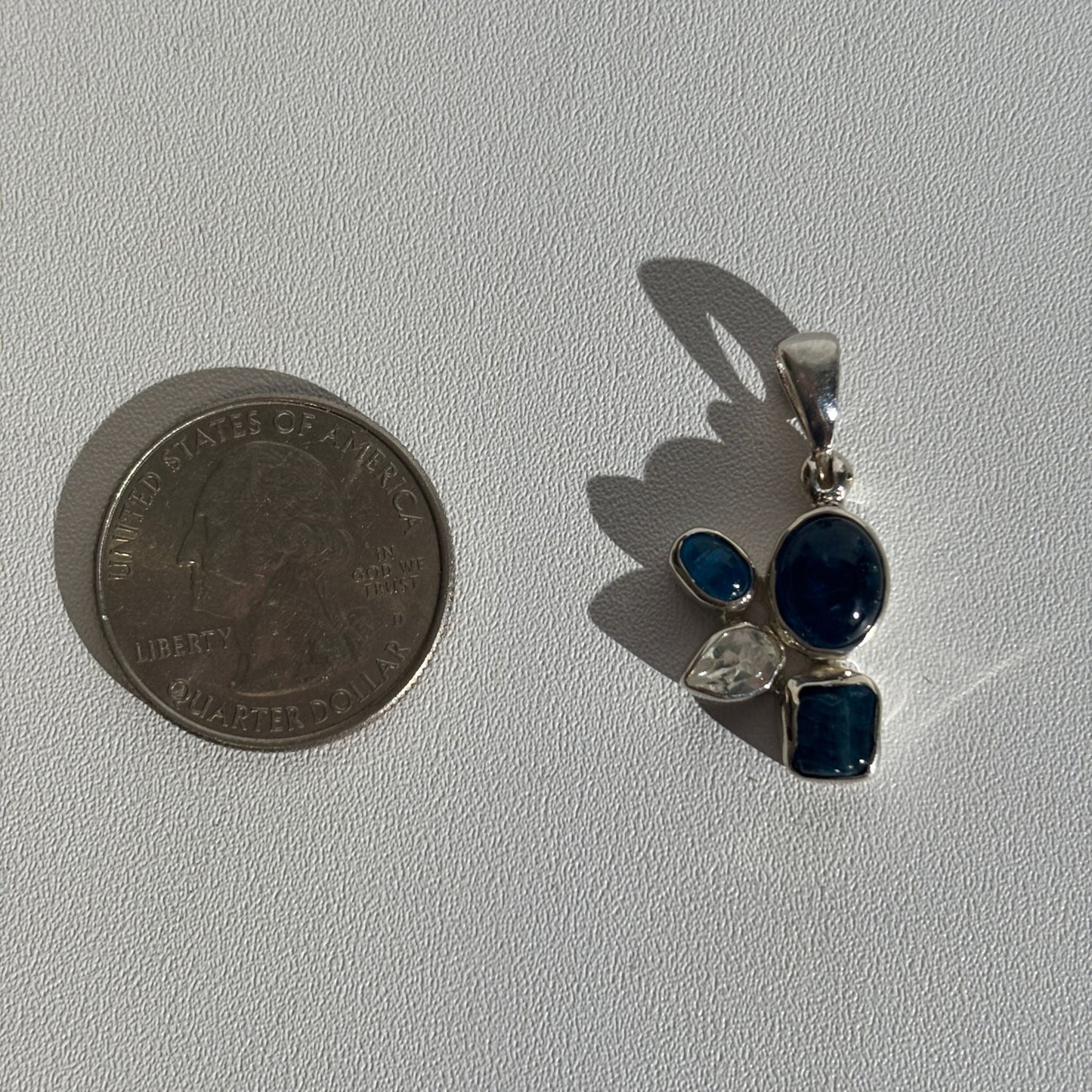 Blue apatite and white topaz pendant size comparison