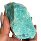 Raw amazonite close up in hand