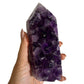 Amethyst geode tower in hand