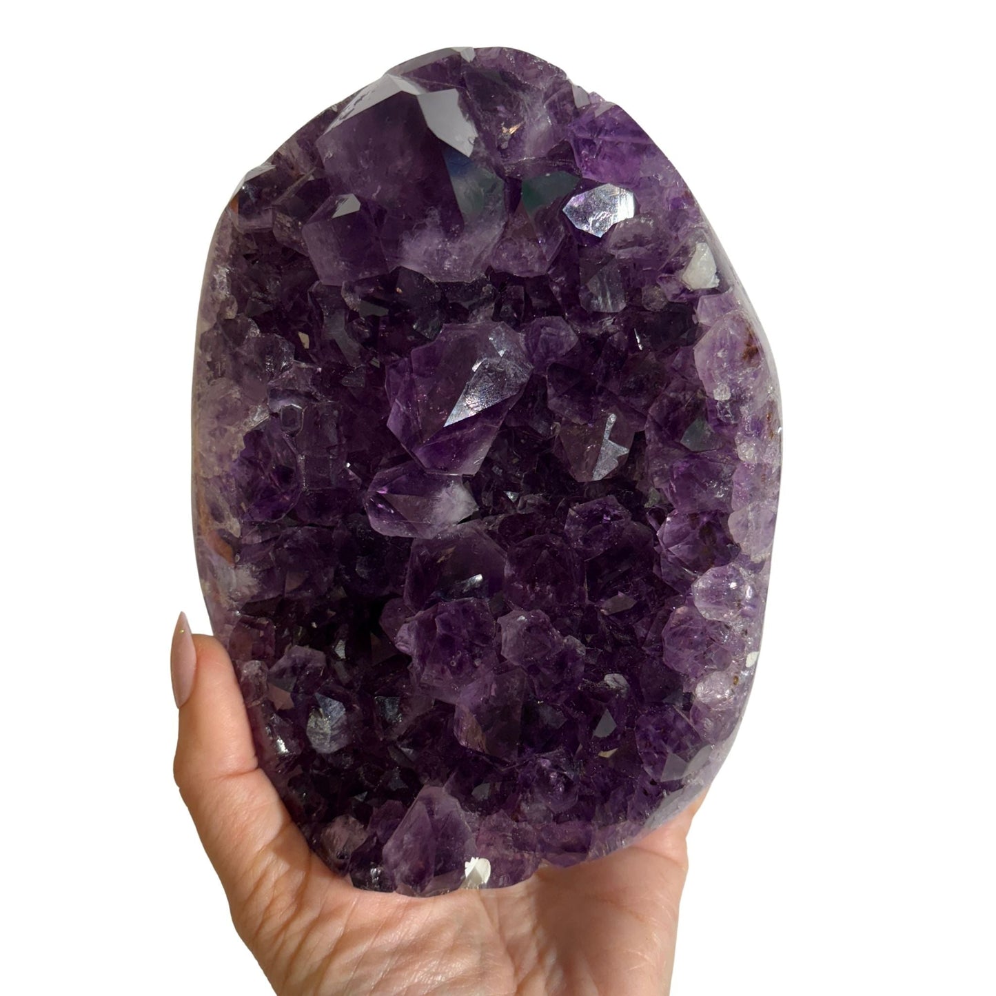 Amethyst geode large purple crystal in hand