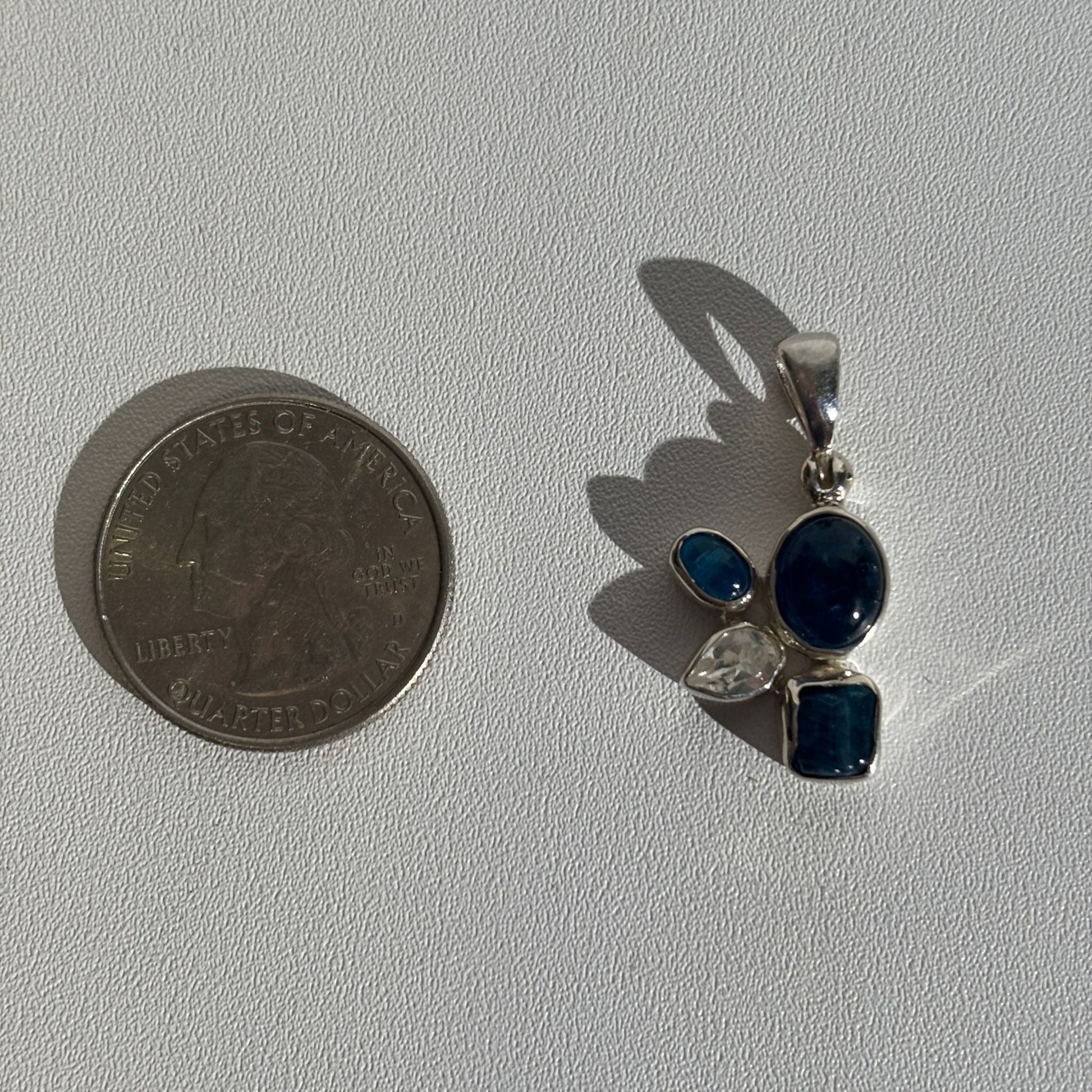 Blue apatite and white topaz pendant size comparison 
