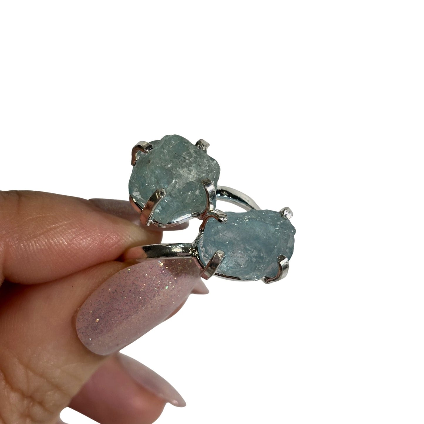 Raw aquamarine dual ring in hand 