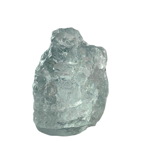 Blue topaz raw gemstone on white background