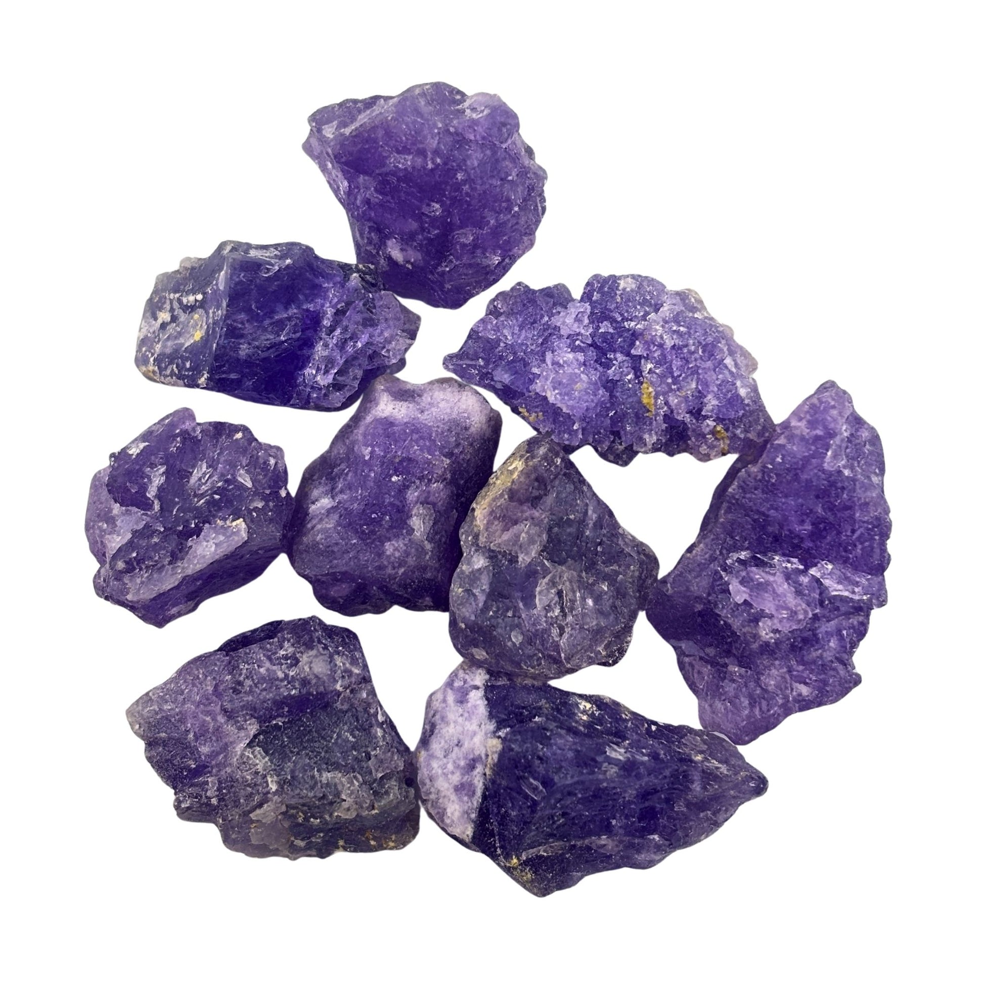 Collection of purple coquimbite crystals on a white background