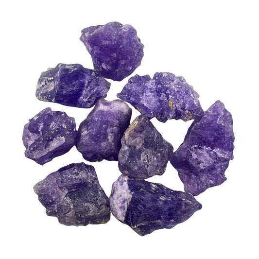 Collection of purple coquimbite crystals on a white background