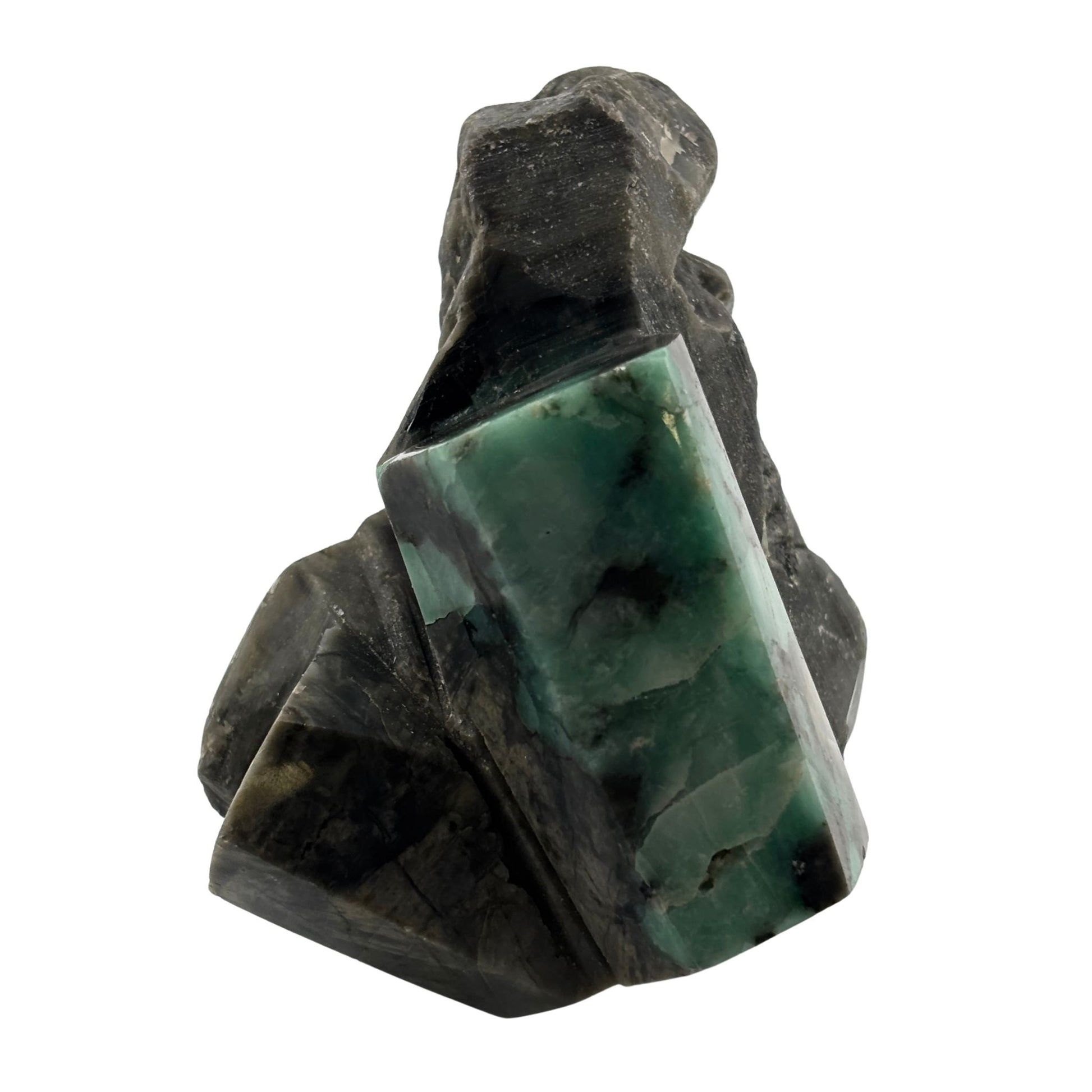 Polished emerald on black rock