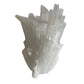 White scolecite crystal formation on a white background