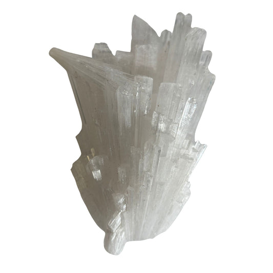 White scolecite crystal formation on a white background