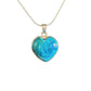 Blue shattuckite heart-shaped pendant on a silver chain against a white background